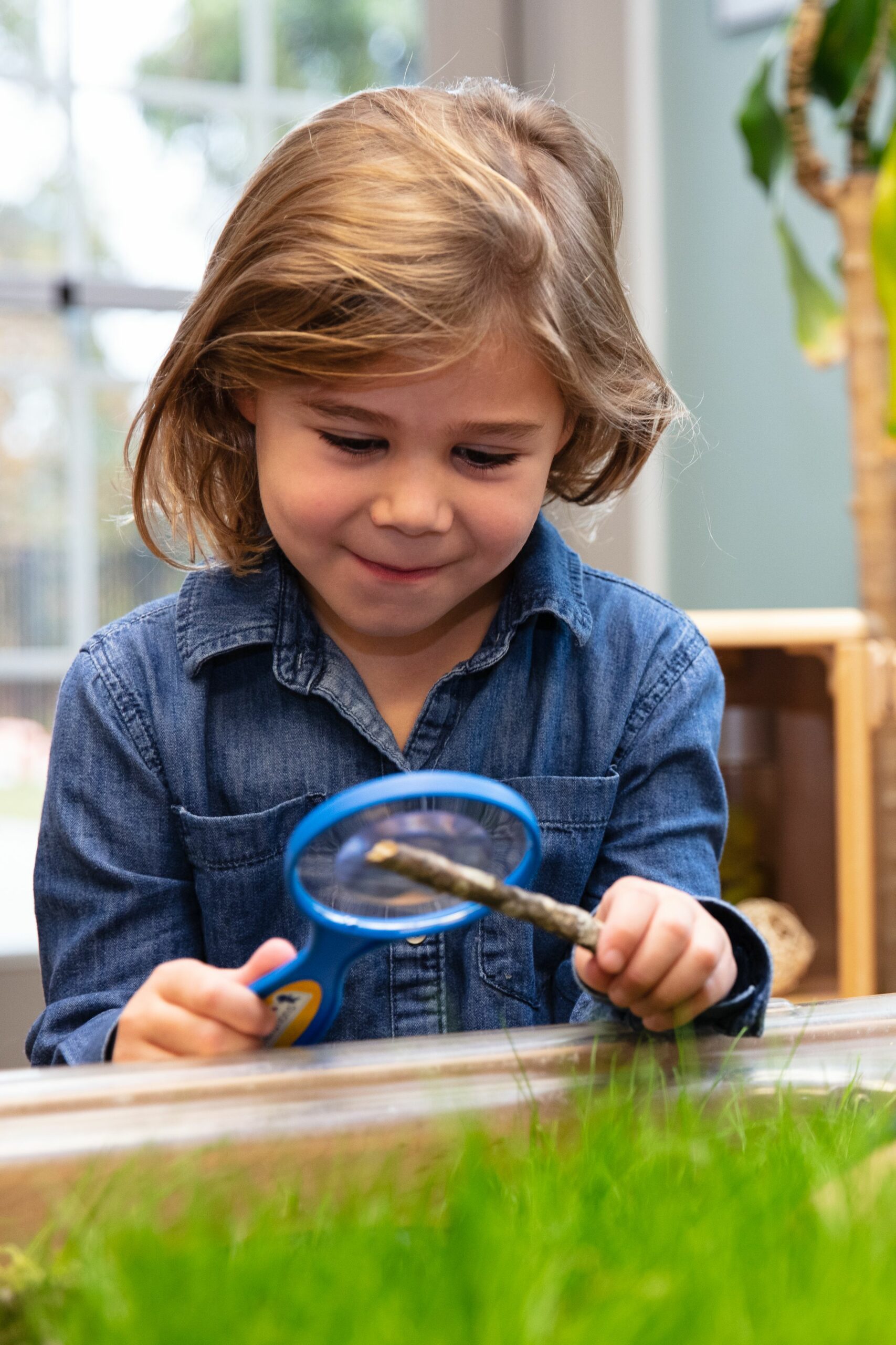 girl with magnifying glass - Endeavor Schools